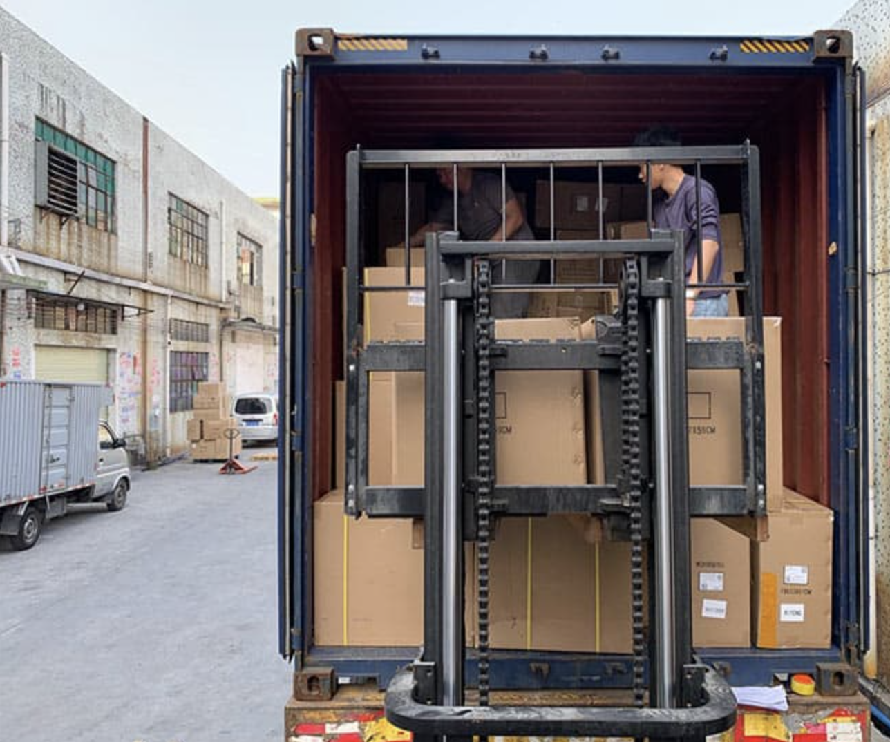 Rice cooker products being loaded into shipping container